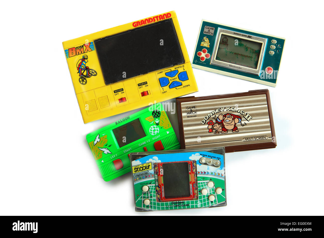 Selection of hand held electronic games including Nintendo Donkey Kong Jr and II which were popular toys in the 1980's Stock Photo