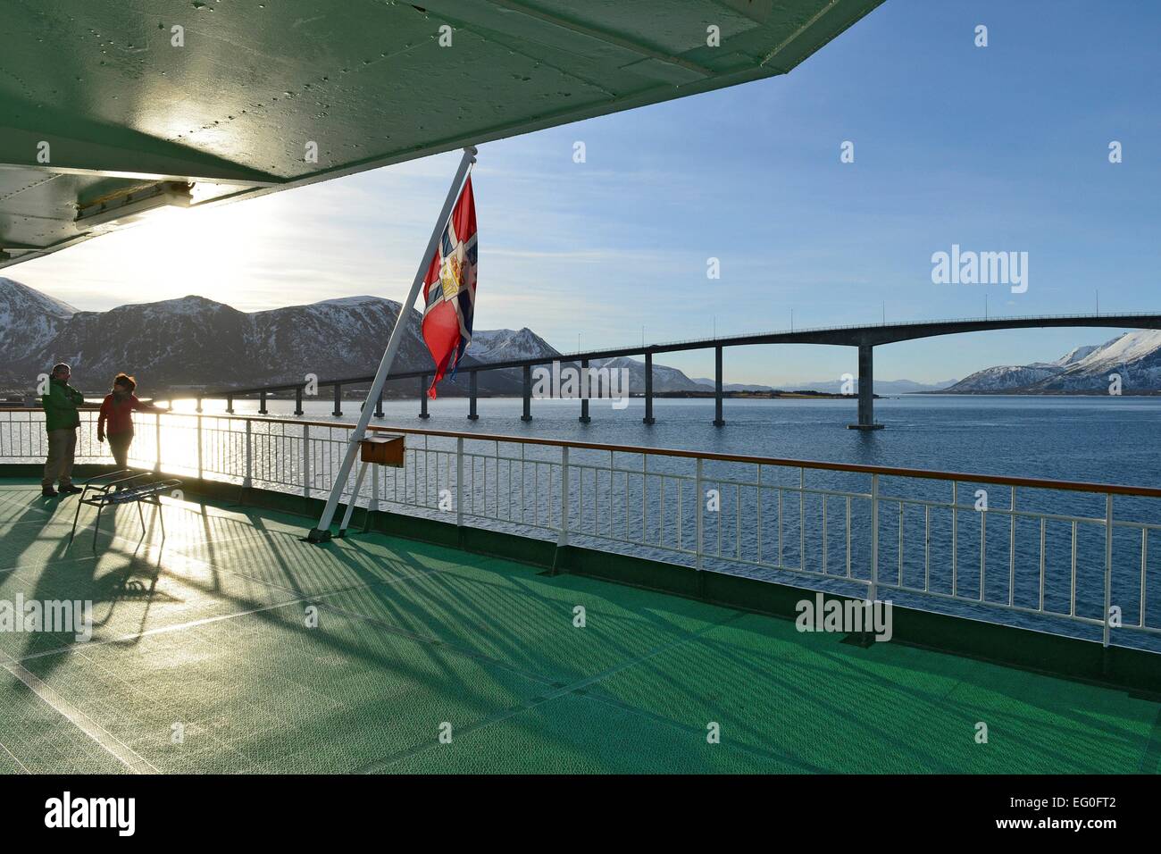 The Andøy Bridge and the stern of the Hurtigruten ship Kong Harald in the bright sunlight, 26 February 2014 Stock Photo