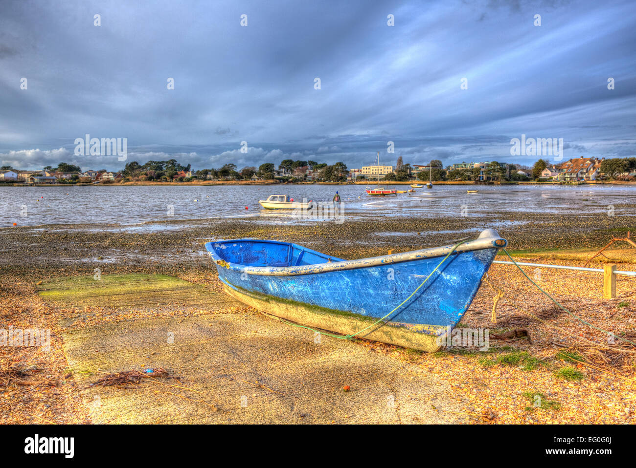 Christchurch harbour near Mudeford Dorset England UK with boats and cloudscape like painting in vivid bright Stock Photo