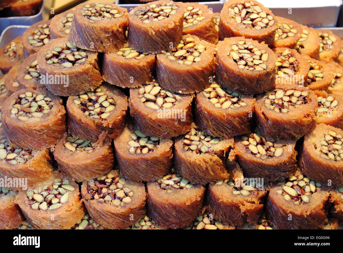 Tray of Burma Baklava, the traditional turkish sweet made with shredded fillo dough wrapped around a pistachios Stock Photo