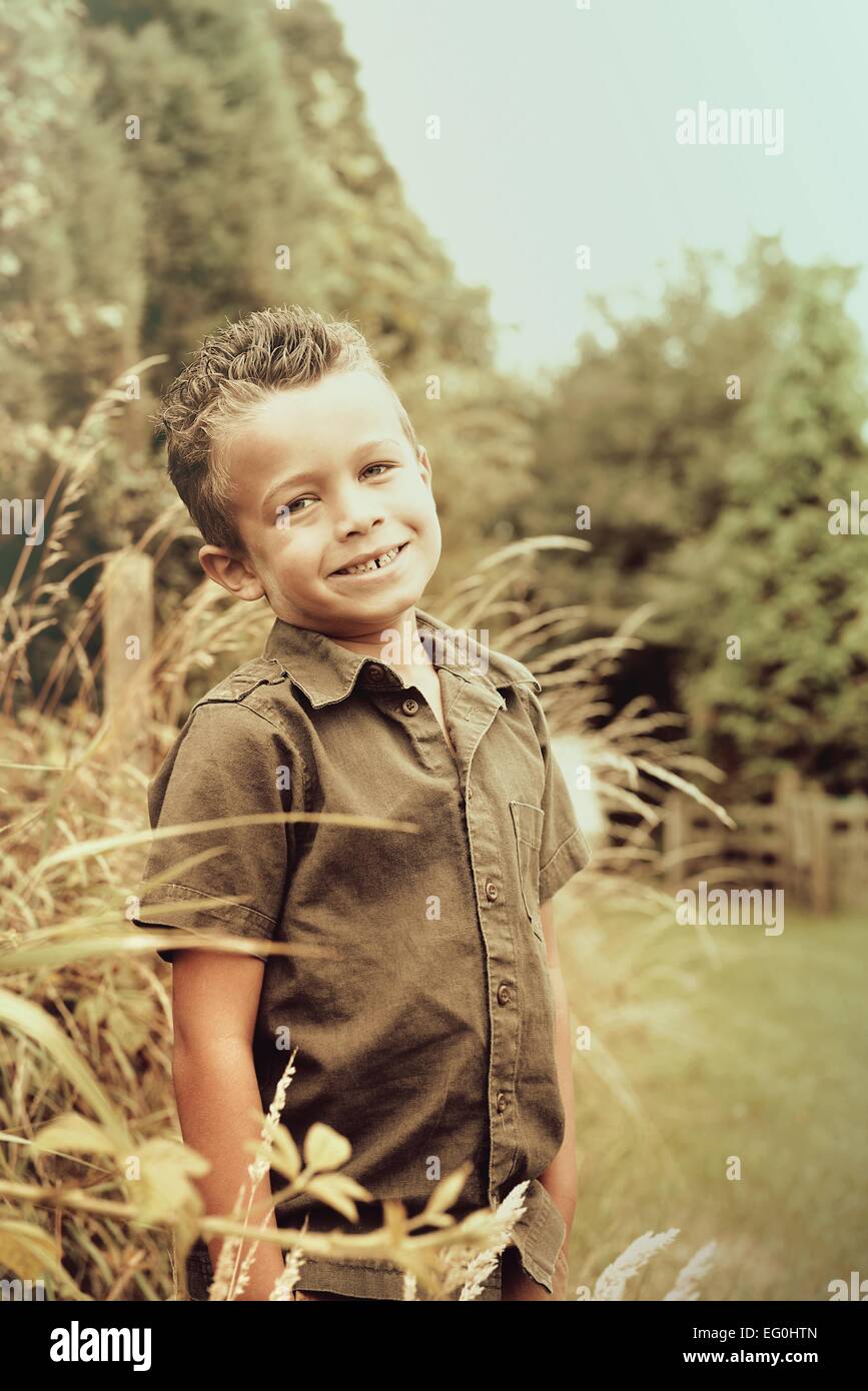 Portrait of smiling boy in countryside Stock Photo