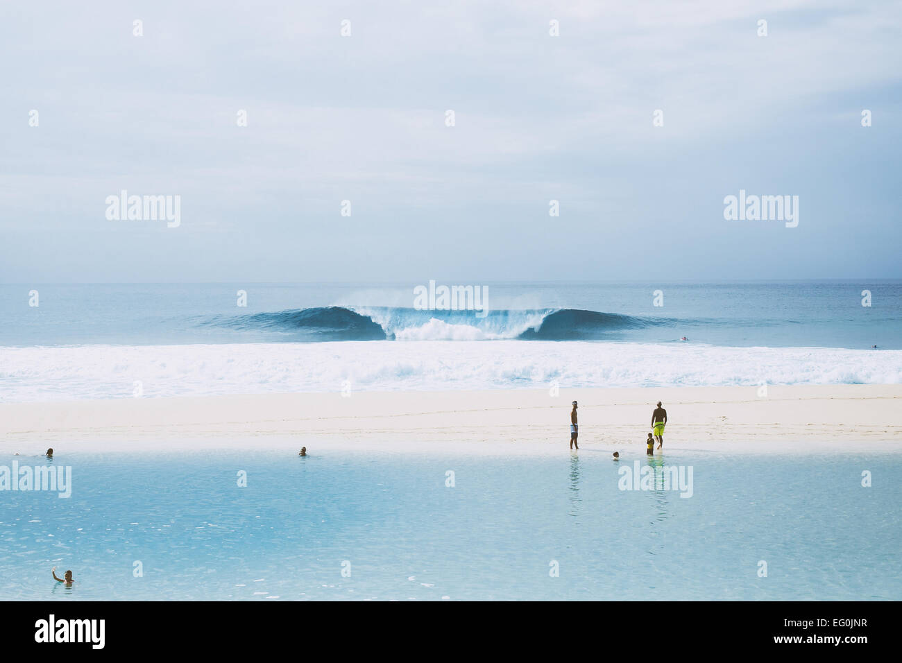 Hawaii, Banzai Pipeline, Perfectly shaped wave by sandy beach Stock Photo