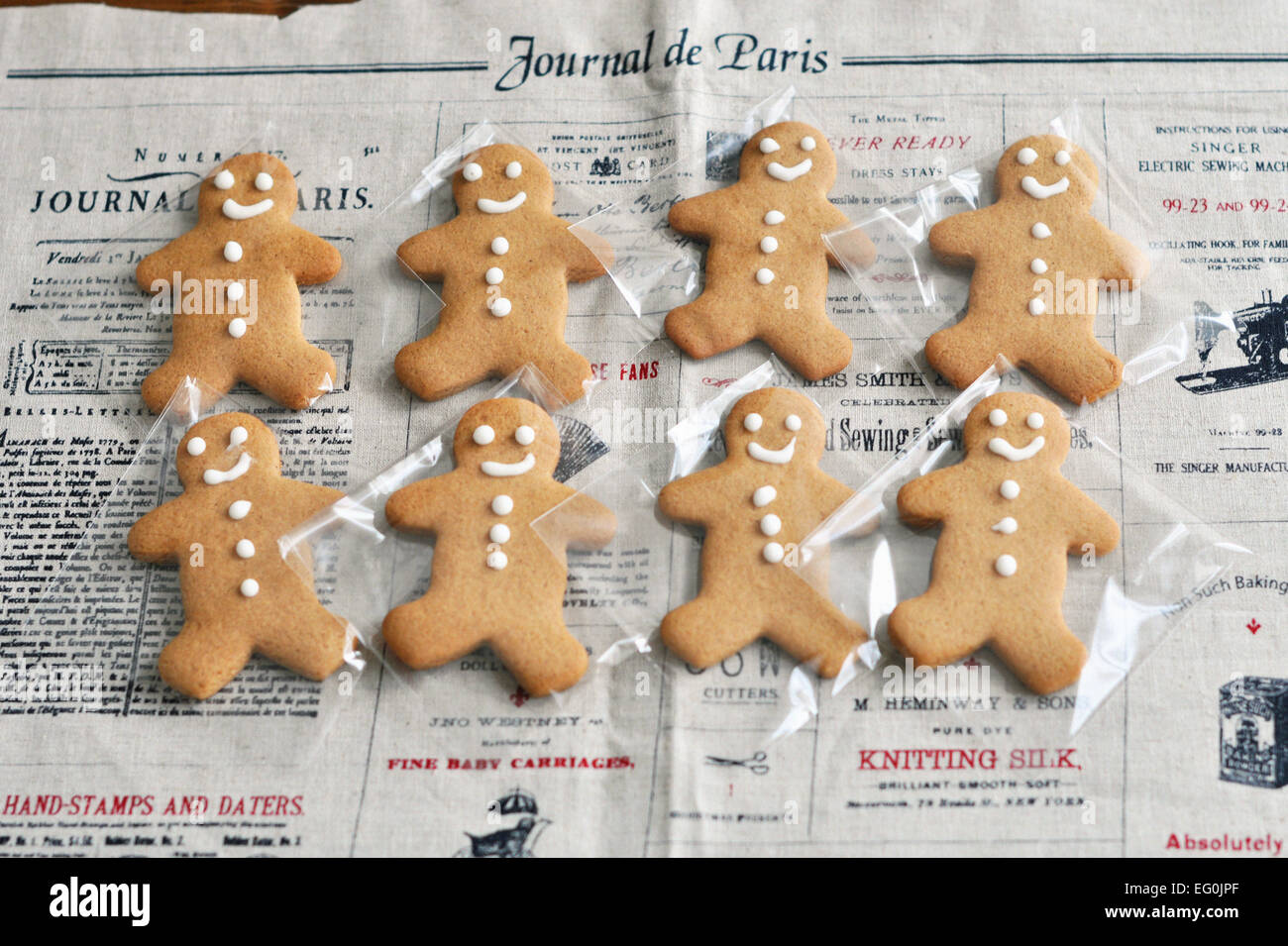 Gingerbread men on newspaper Stock Photo