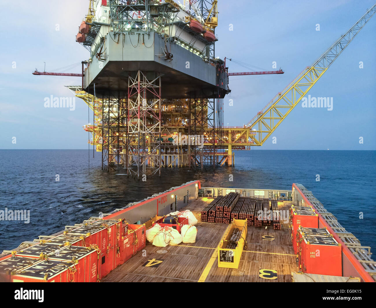 Oil rig support vessel approaching oil rig Stock Photo Alamy