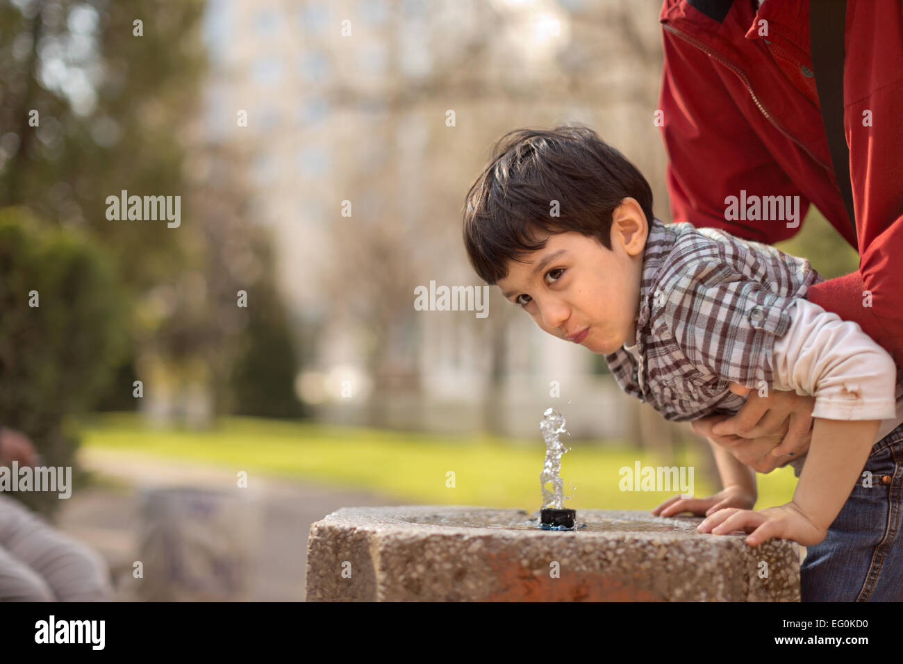Boy (4-5) drinking water Stock Photo