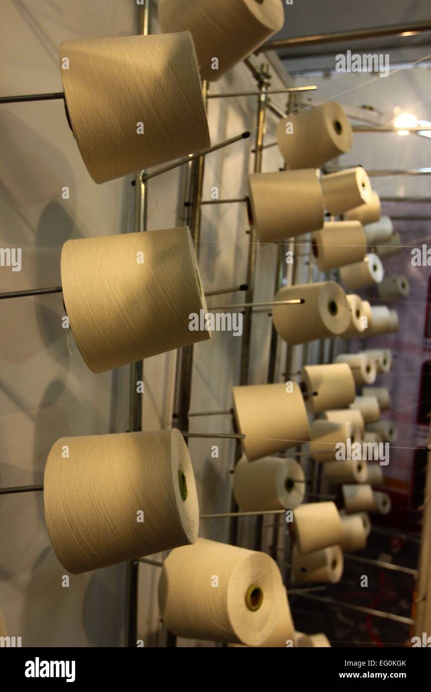 Dhaka 09 February 2015. Group of bobbin thread cones on a warping ...