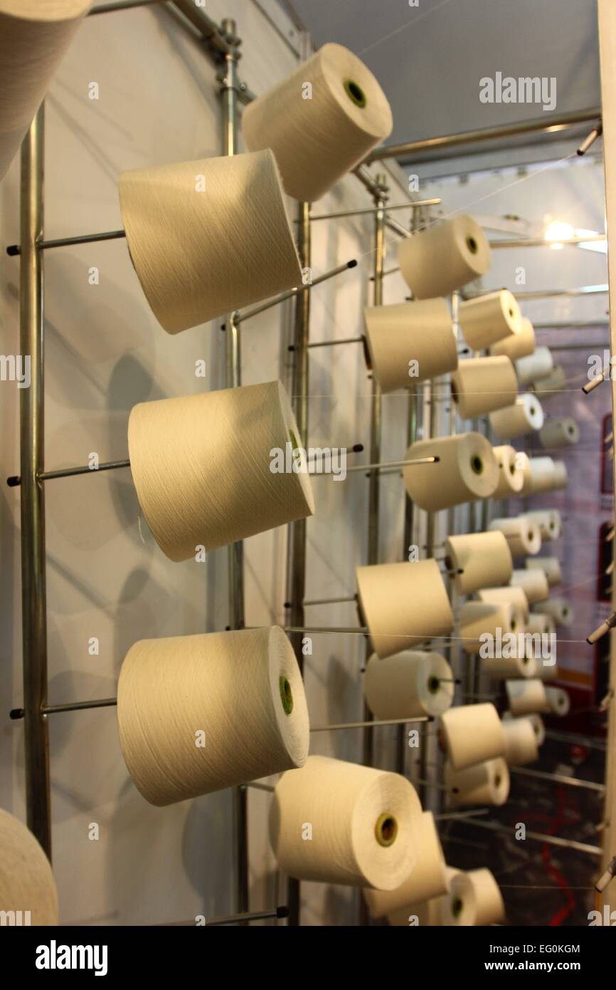 Dhaka 09 February 2015. Group of bobbin thread cones on a warping ...