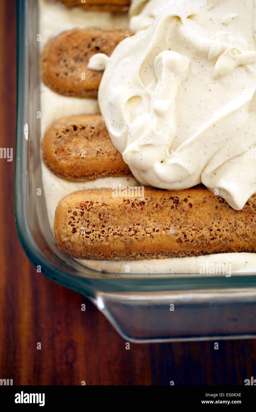 Whipped cream over tiramisu biscuits Stock Photo Alamy