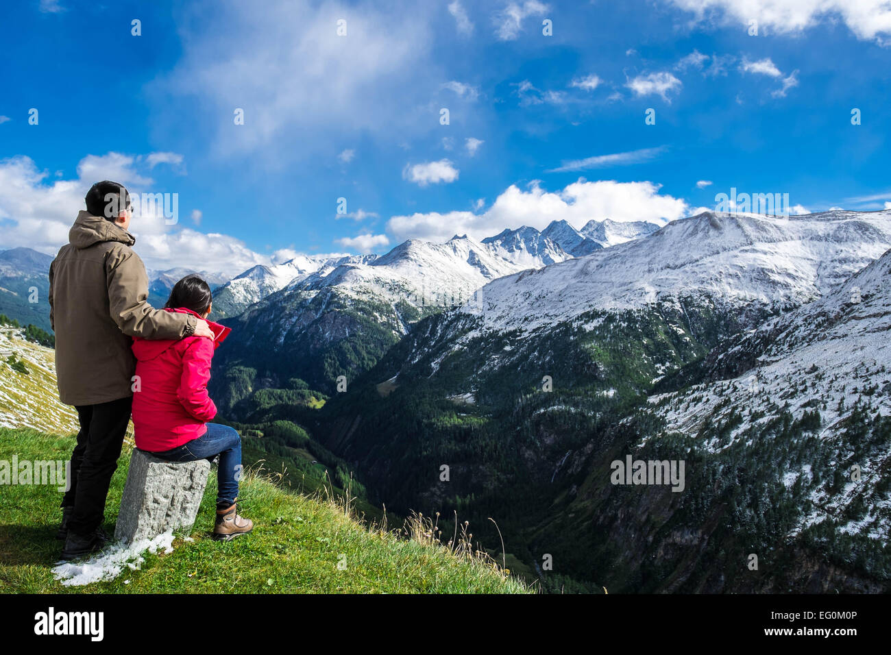 Austria, Grossglockner, Mid-adult couple looking at mountain range Stock Photo