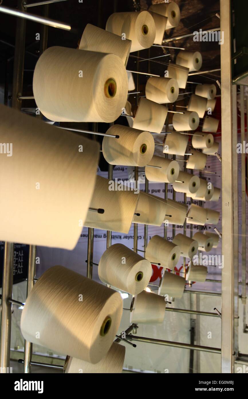 Dhaka 09 February 2015. Group of bobbin thread cones on a warping ...