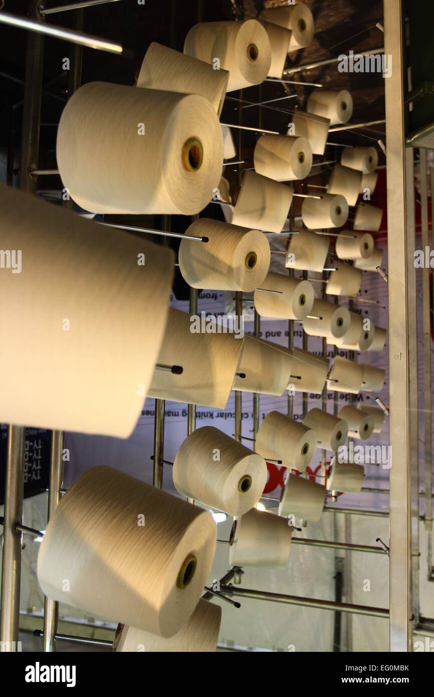 Dhaka 09 February 2015. Group of bobbin thread cones on a warping ...