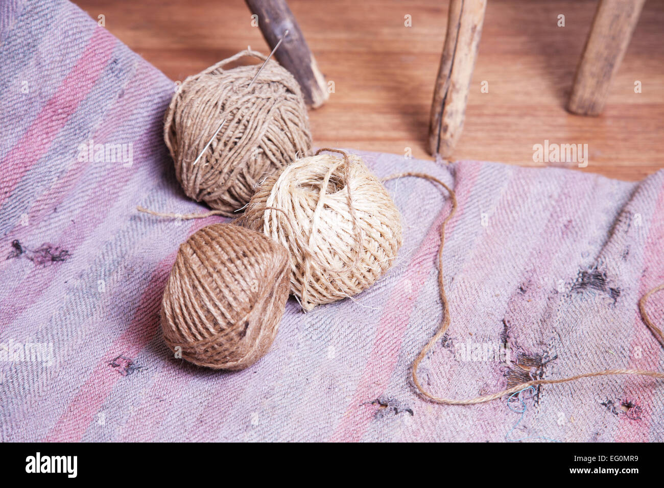 Hank of rope on the floor Stock Photo - Alamy