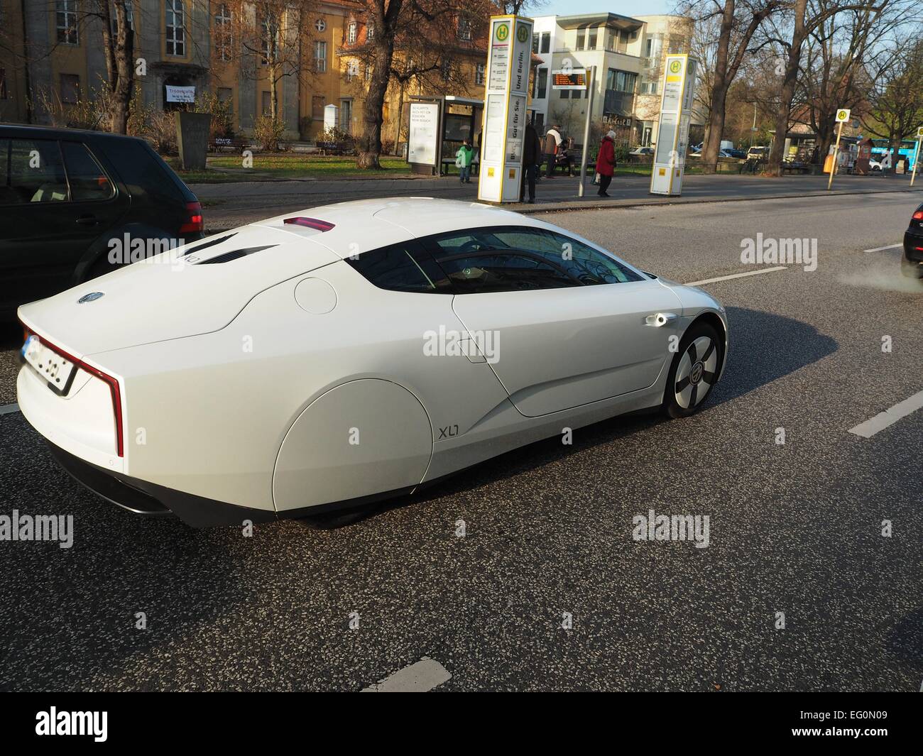 A Volkswagen VW XL1 one liter car driving in a street in Berlin on December 06, 2014. Photo: Wolfram Steinberg/dpa Stock Photo