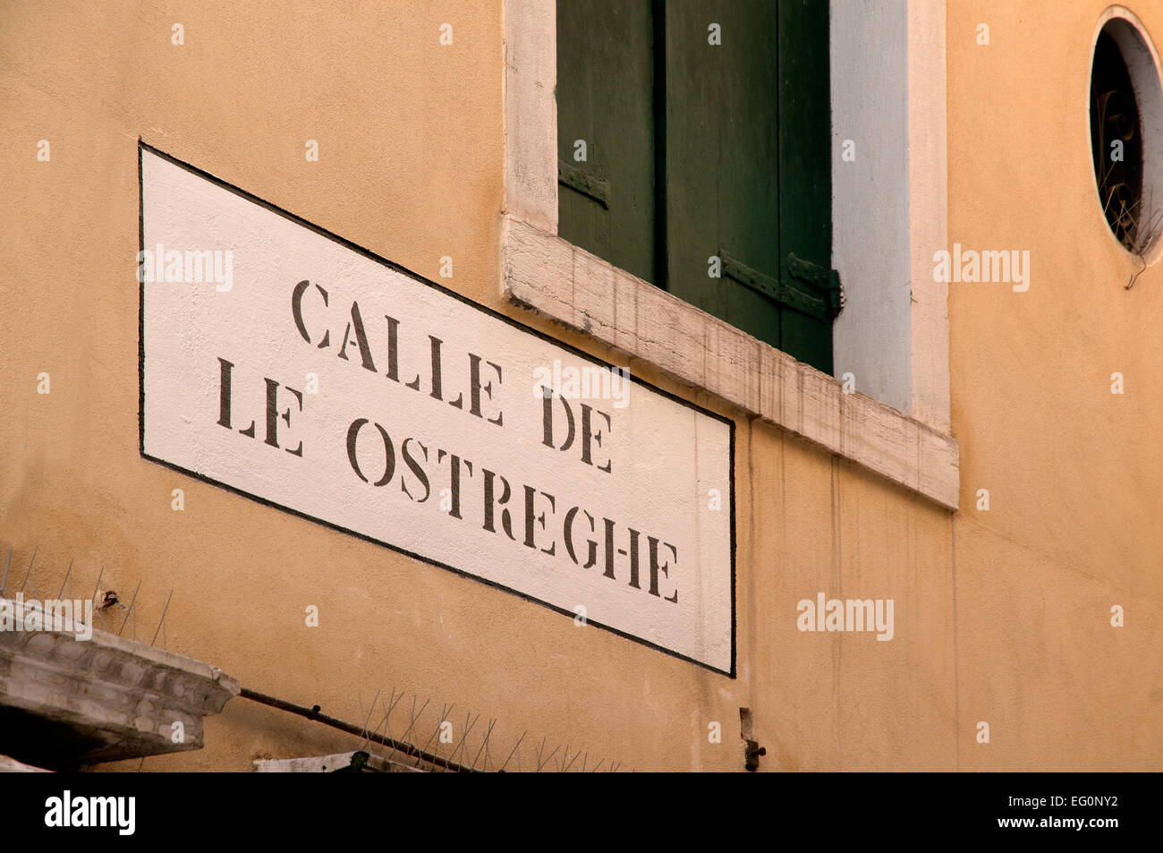 Street sign reading Calle de le Ostreghe Venice Italy Stock Photo