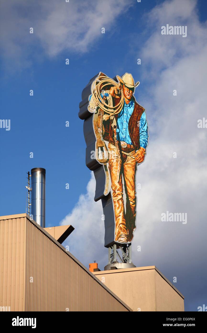The Marlboro Man is seen on the roof of a Philip Morris tobacco plant in Berlin January 8, 2015. Photo: Wolfram Steinberg/dpa Stock Photo