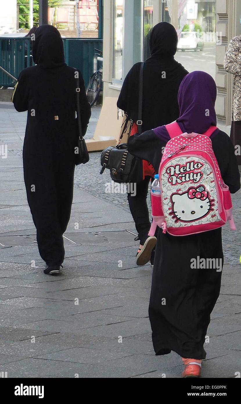 A Muslim girl carrying a pink Hello Kitty bag in Berlin, September 28, 2014. Photo: Wolfram Steinberg/dpa Stock Photo