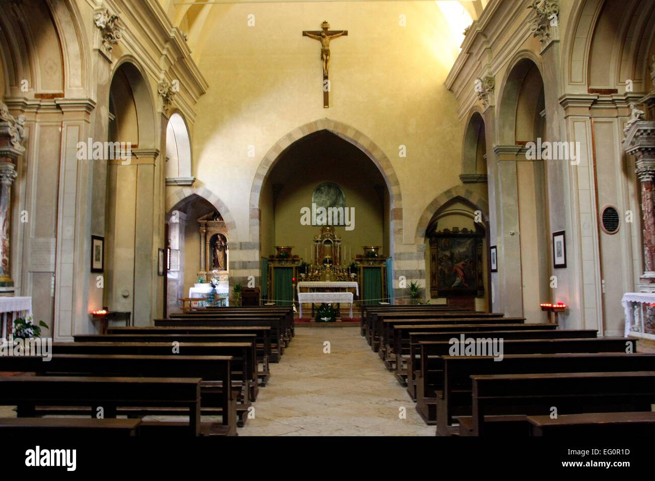 Nave and mainaltar of the church of San Francesco (St. Francis). It was built in 1289 by Franciscan monks in Gargnano, Italy. It is a simple Romanesque church. In 1912 the church was classified as a National Monument by the Italian government. Photo: Klaus Stock Photo