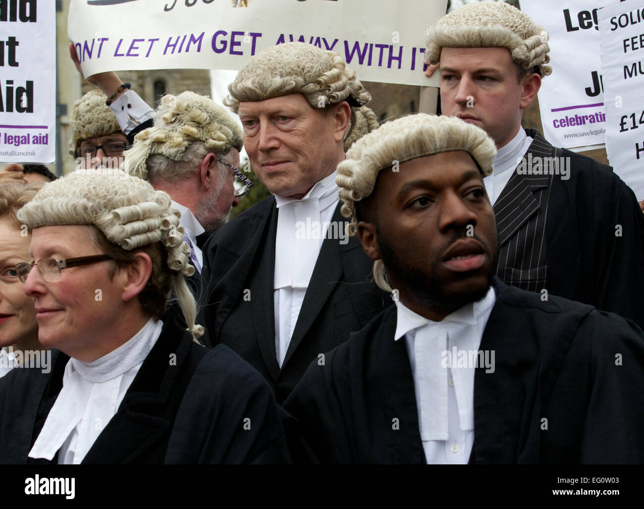 UNITED KINGDOM, London : Members of the British Justice system hold placard in protest of the cuts to the legal aid budget during a protest outside The Houses of Parliament in London on March 7, 2014. Stock Photo