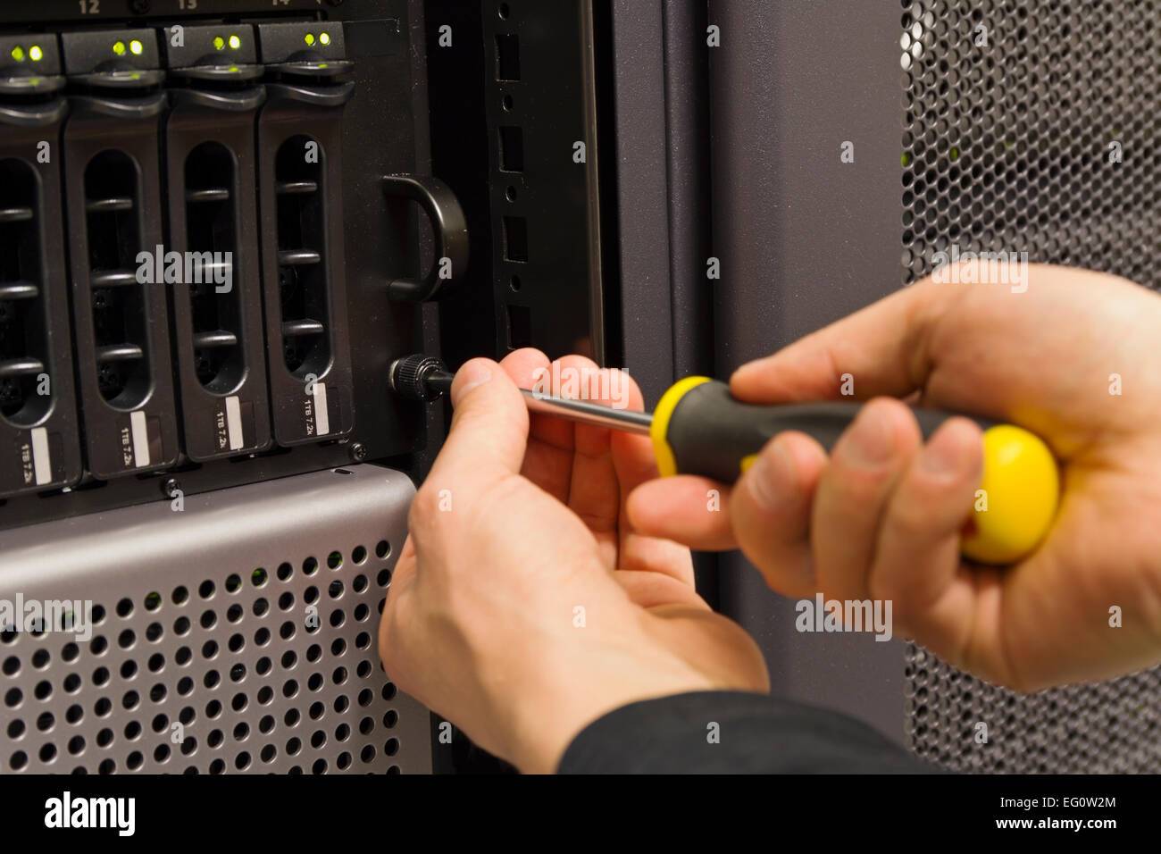 Installing server and disk cabinet / SAN in rack at a data center Stock ...