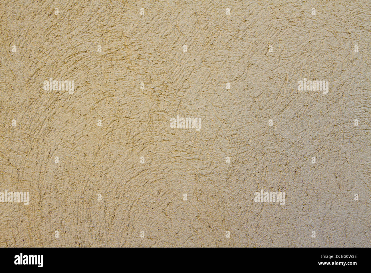 Beige grunge wall image of a textured concrete wall. It's a brown / beige colored background. Stock Photo