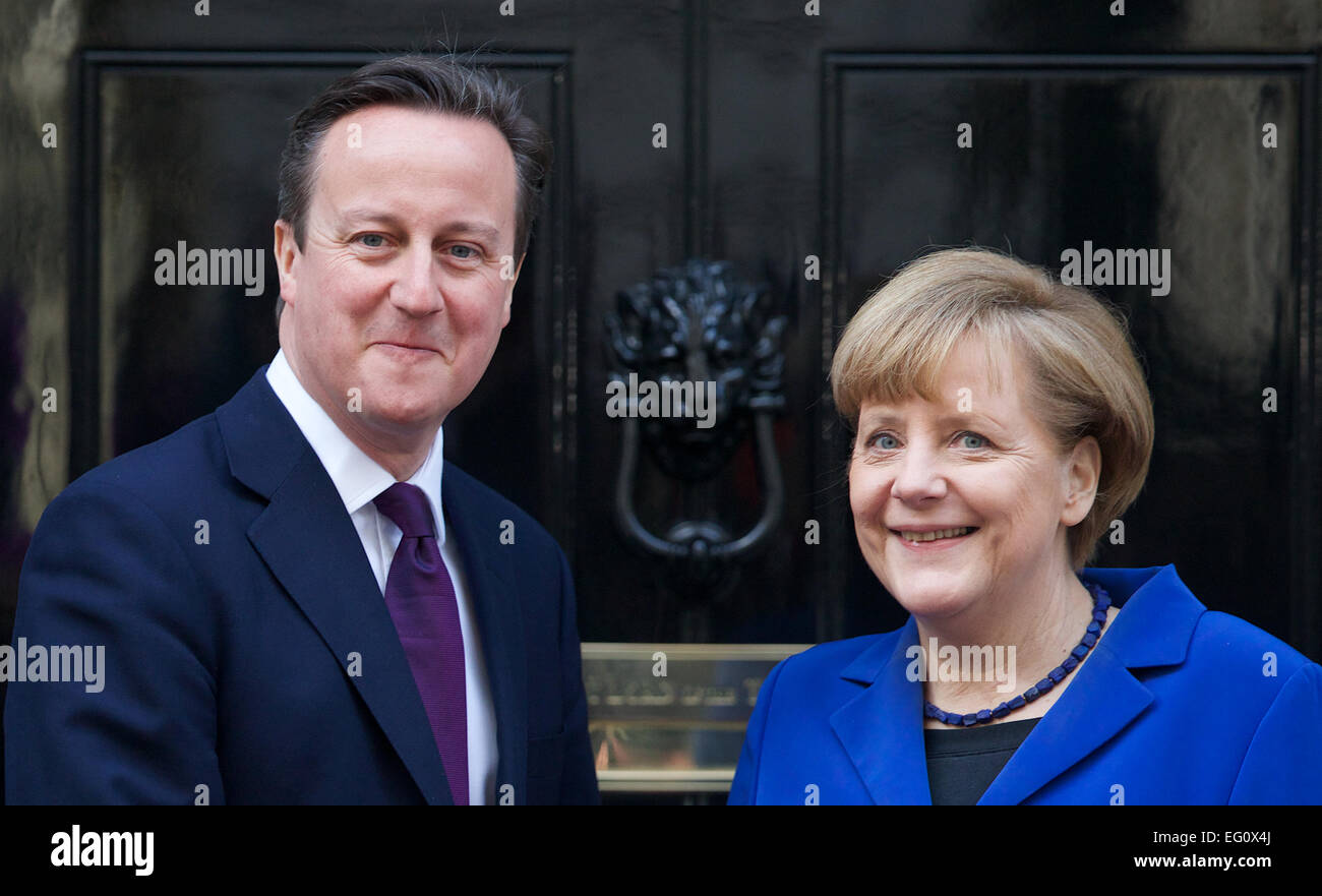 UNITED KINGDOM, London : David Cameron greets the German Chancellor Angela Merkel on the steps of number 10 Downing street in central London on February 27, 2014. Stock Photo