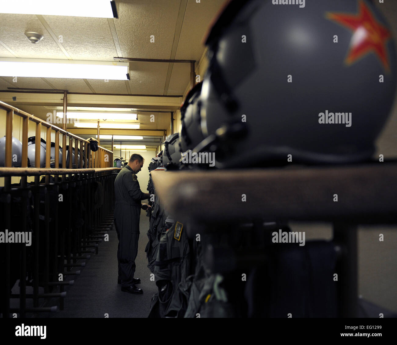 Capt. Joshua Platt, an F-15 Strike Eagle pilot assigned to the 390th Fighter Squadron, Mountain Home Air Force Base, Idaho, inspects his gear in preparation for a training mission during exercise Maple Flag 42 at 4 Wing Cold Lake, Canada, June 8, 2009. Maple Flag is a Canadian-sponsored and Air Combat Command supported exercise, that provides aircrews simulated air and ground combat training to coalition forces in a NATO environment. Senior Airman Larry E. Reid Jr. Stock Photo