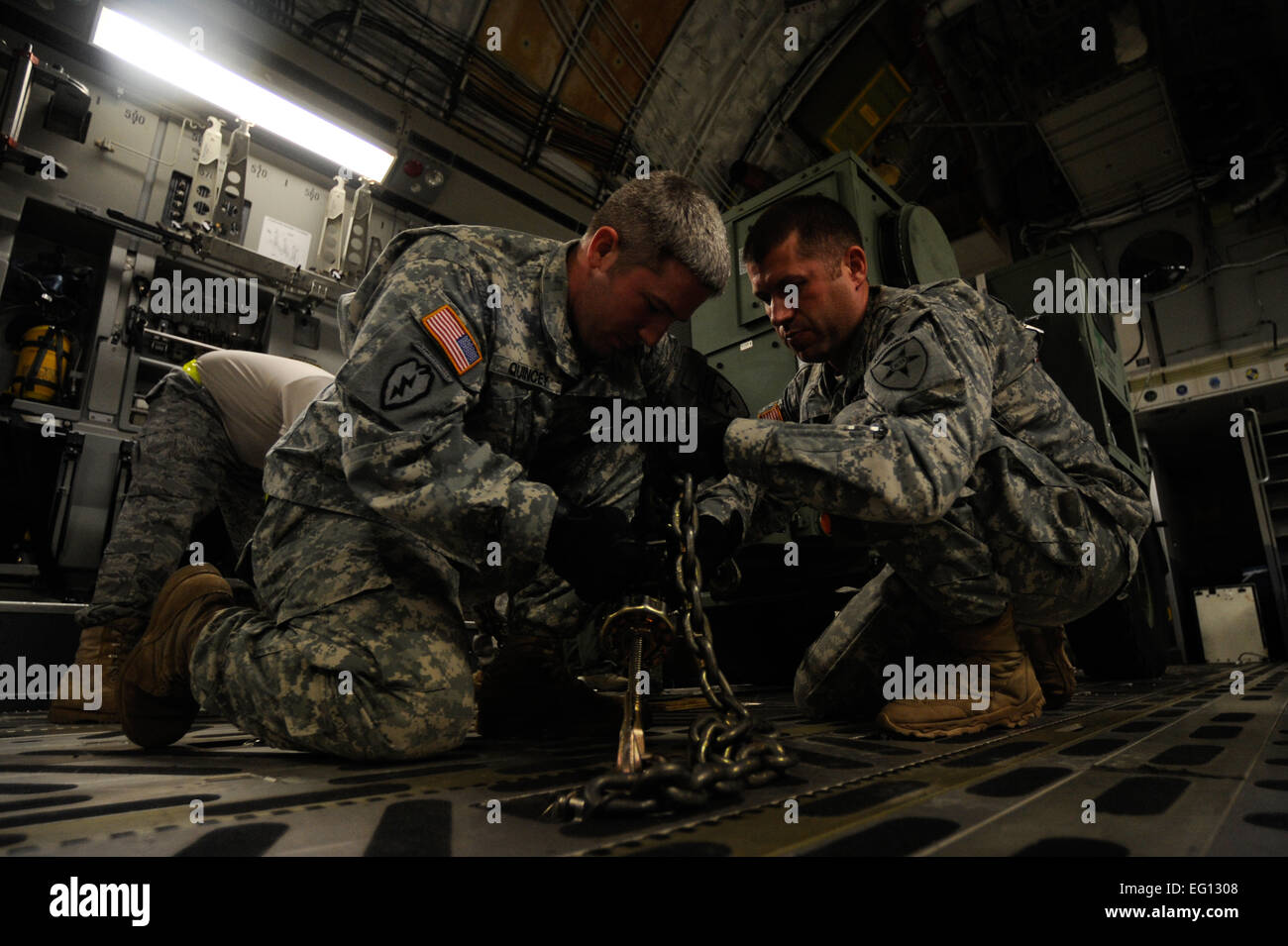 U.S. Army Soldiers from Joint Communications Support Element work to load a generator on a U.S. Air Force C-17 Globemaster III aircraft headed to Haiti for earthquake relief efforts Jan. 15, 2010 at MacDill Air Force Base Fla. : Staff Sgt. Jason RobertsonNot Reviewed Stock Photo