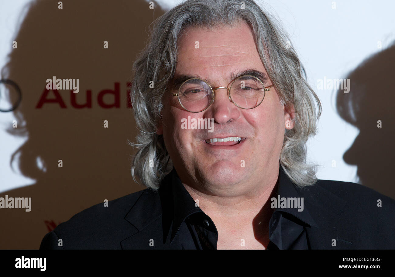 UNITED KINGDOM: British Director Paul Greengrass poses for pictures on the red carpet as she arrives for the 34th London Critics Circle Film Awards in central London on February 2, 2014. Stock Photo