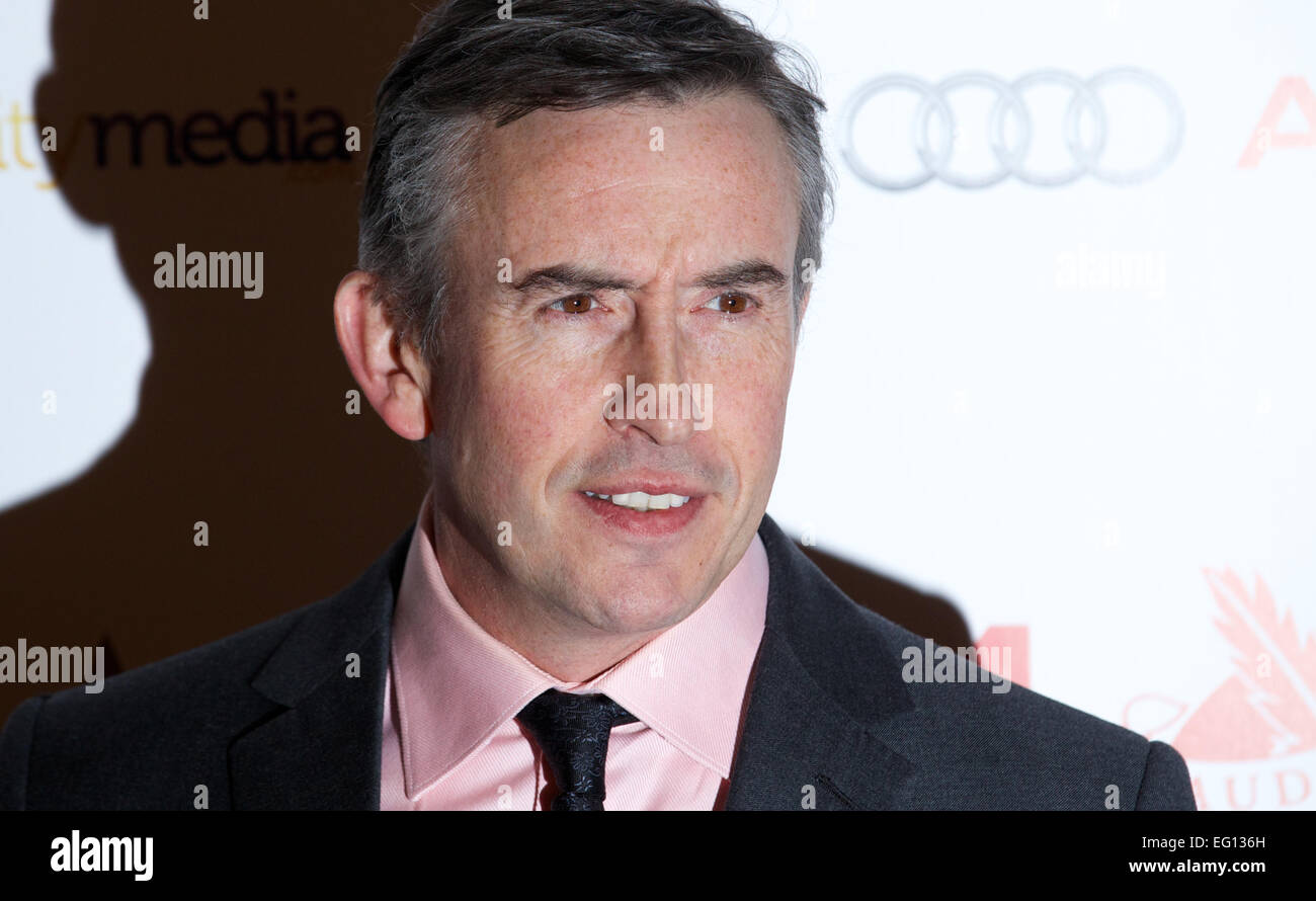 UNITED KINGDOM: British actor Steve Coogan poses for pictures on the red carpet as she arrives for the 34th London Critics Circle Film Awards in central London on February 2, 2014. Stock Photo