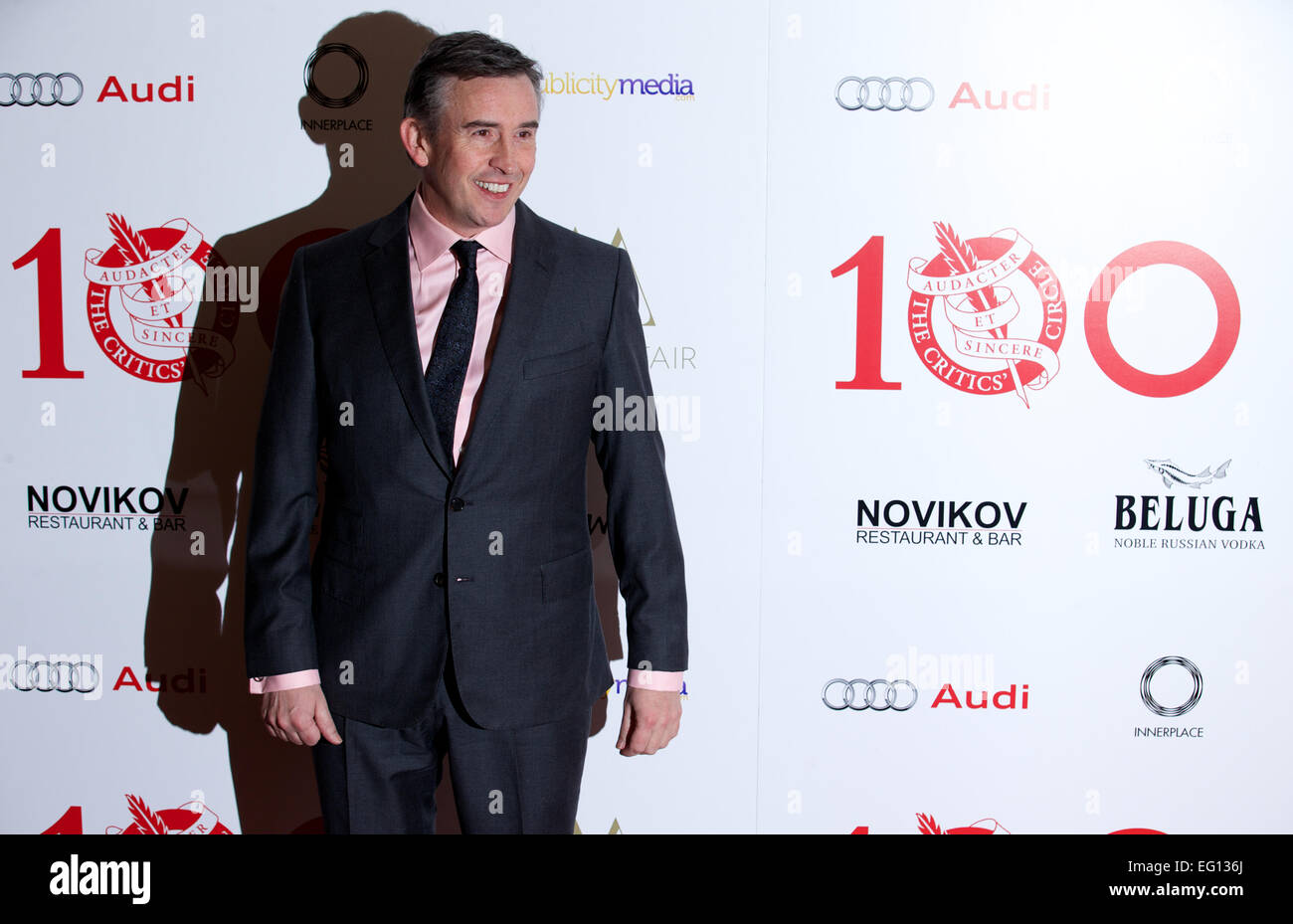 UNITED KINGDOM: British actor Steve Coogan poses for pictures on the red carpet as she arrives for the 34th London Critics Circle Film Awards in central London on February 2, 2014. Stock Photo