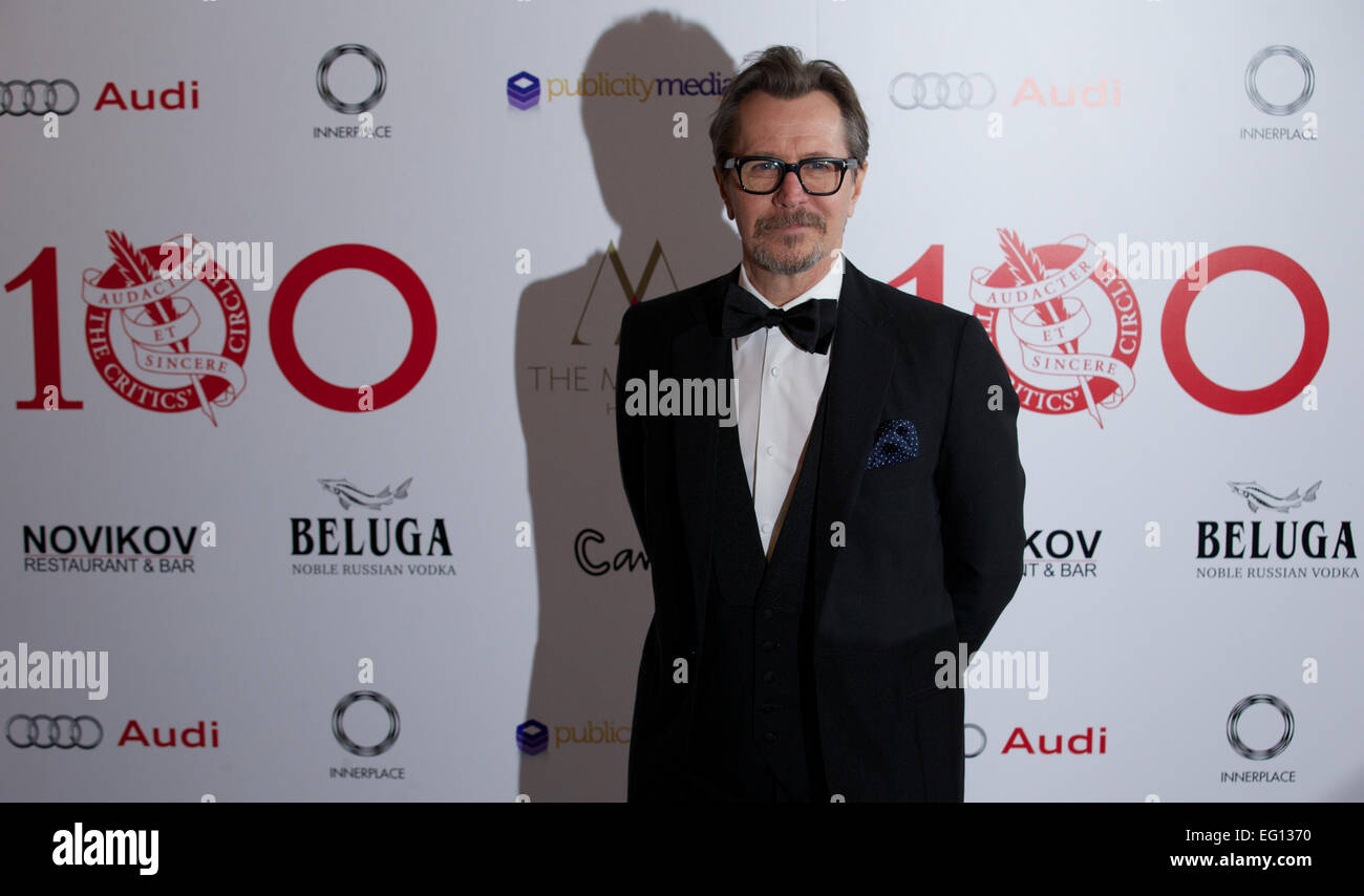 UNITED KINGDOM: British actor Gary Oldman poses for pictures on the red carpet as she arrives for the 34th London Critics Circle Film Awards in central London on February 2, 2014. Stock Photo