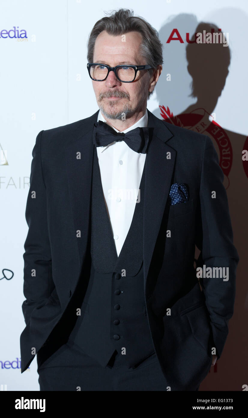 UNITED KINGDOM: British actor Gary Oldman poses for pictures on the red carpet as she arrives for the 34th London Critics Circle Film Awards in central London on February 2, 2014. Stock Photo