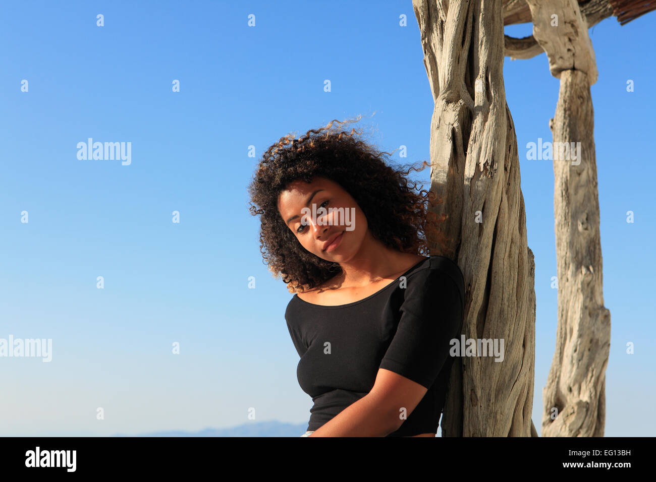 greece a young mixed race girl posing on holiday Stock Photo - Alamy