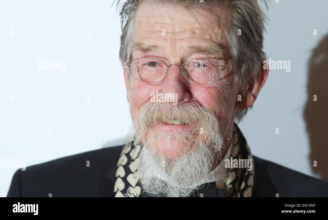 UNITED KINGDOM: British actor John Hurt poses for pictures on the red carpet as she arrives for the 34th London Critics Circle Film Awards in central London on February 2, 2014. Stock Photo