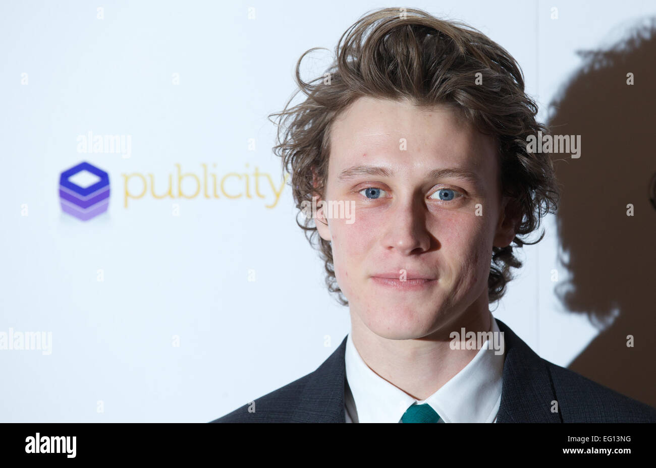 UNITED KINGDOM: British actor George MacKay poses for pictures on the red carpet as he arrives for the 34th London Critics Circle Film Awards in central London on February 2, 2014. Stock Photo