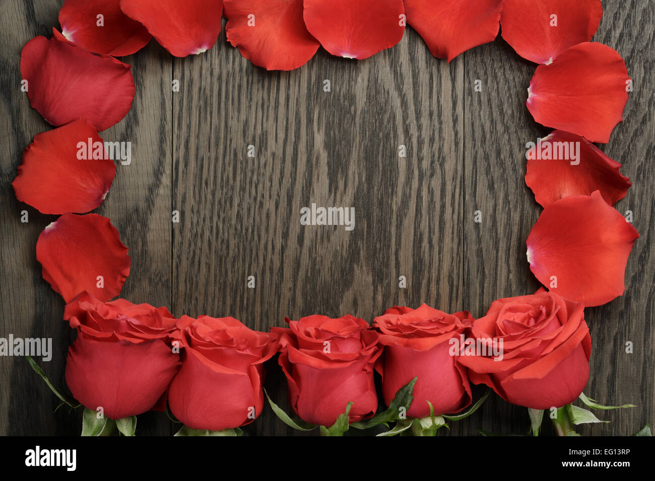 Romantic background with red roses on wood table Stock Photo - Alamy