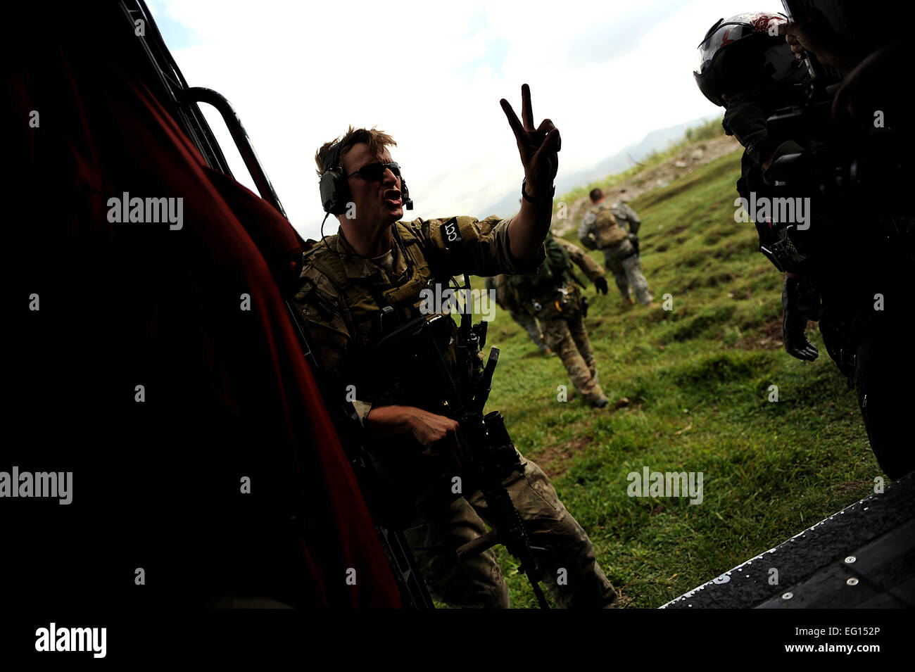 U.S. Air Force Combat Controllers and U.S. Army Pathfinders land in a