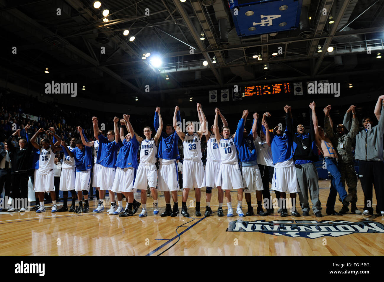 U.S. Air Force Academy, CO- Members of the Falcons and fans raise their hands in celebration of their win over the Wyoming Cowboys at Clune Arena 30 Jan. They won 70-63. This win broke a 22-game conference losing streak for the Falcons; their first win in the Mountain West Conference since March 5, 2008.  J. Rachel Spencer Stock Photo