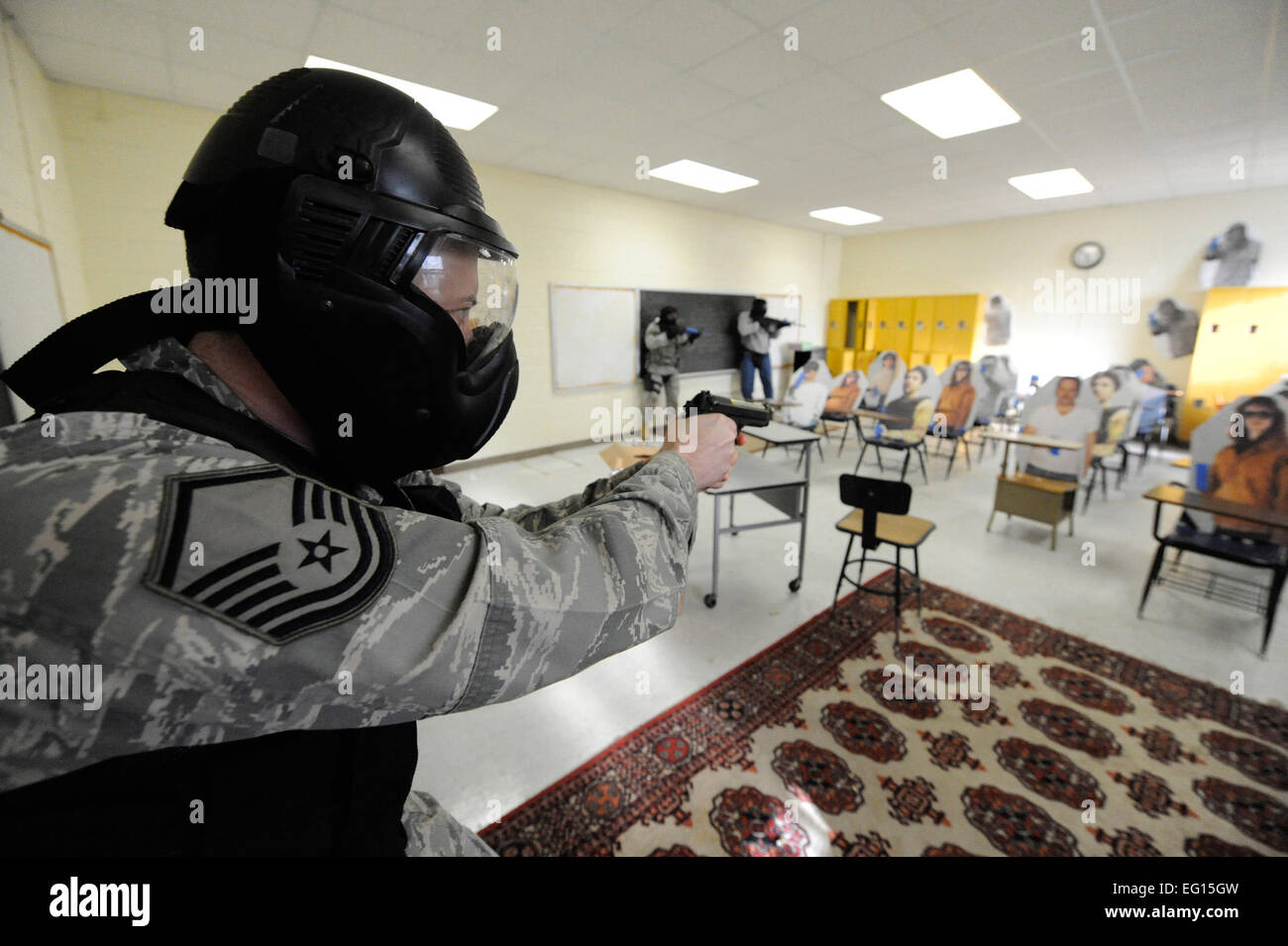 U.S. Air Force Master Sgt. David Dalbec, clears a room during the Active Shooter Training Course in Mt. Pleasant, S.C., Feb. 23, 2010. The AST course prepares first responders on how to react to a hostile situation. Sergeant Dalbec is an combat arms instructor with the 148th Fighter wing Duluth, Minn.  James M. Bowman Stock Photo