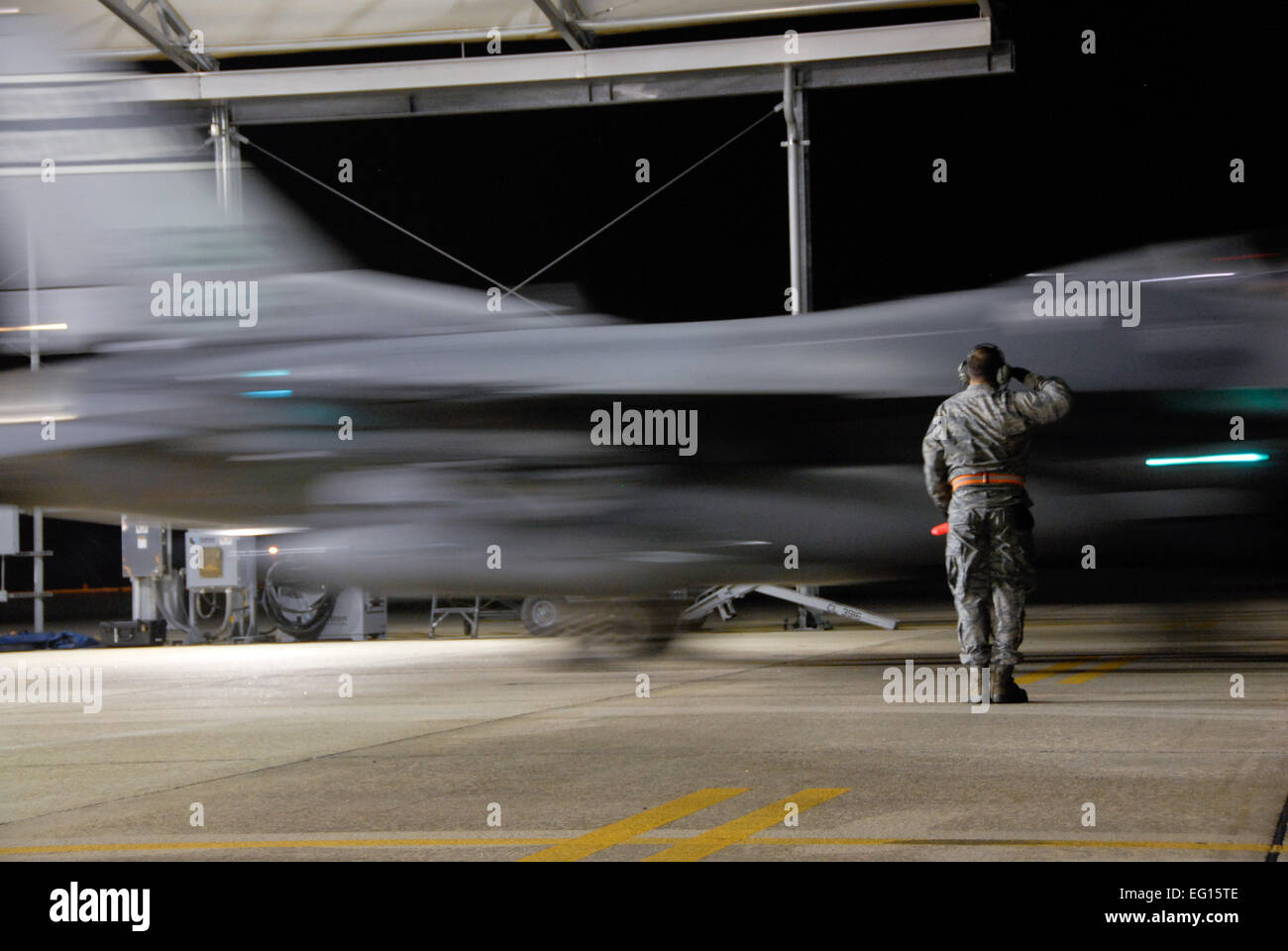 Technical Sgt. Jeff Hopper, a crew chief assigned to the 169th Aircraft Maintenance Squadron, salutes as an F-16 Block 52 D, as it taxis out to the runway. The 169th Fighter Wing at McEntire Joint National Guard Base, South Carolina, is sending F-16 fighter jets, pilots, maintenance specialists and support personnel overseas for its first major combat operation since 2003, when the unit deployed to Operation Iraqi Freedom and flew more than 400 combat missions.   The 169th FW is now an 'Active Associate' wing. This unprecedented agreement with the 20th Fighter Wing at Shaw AFB Base embeds 150  Stock Photo