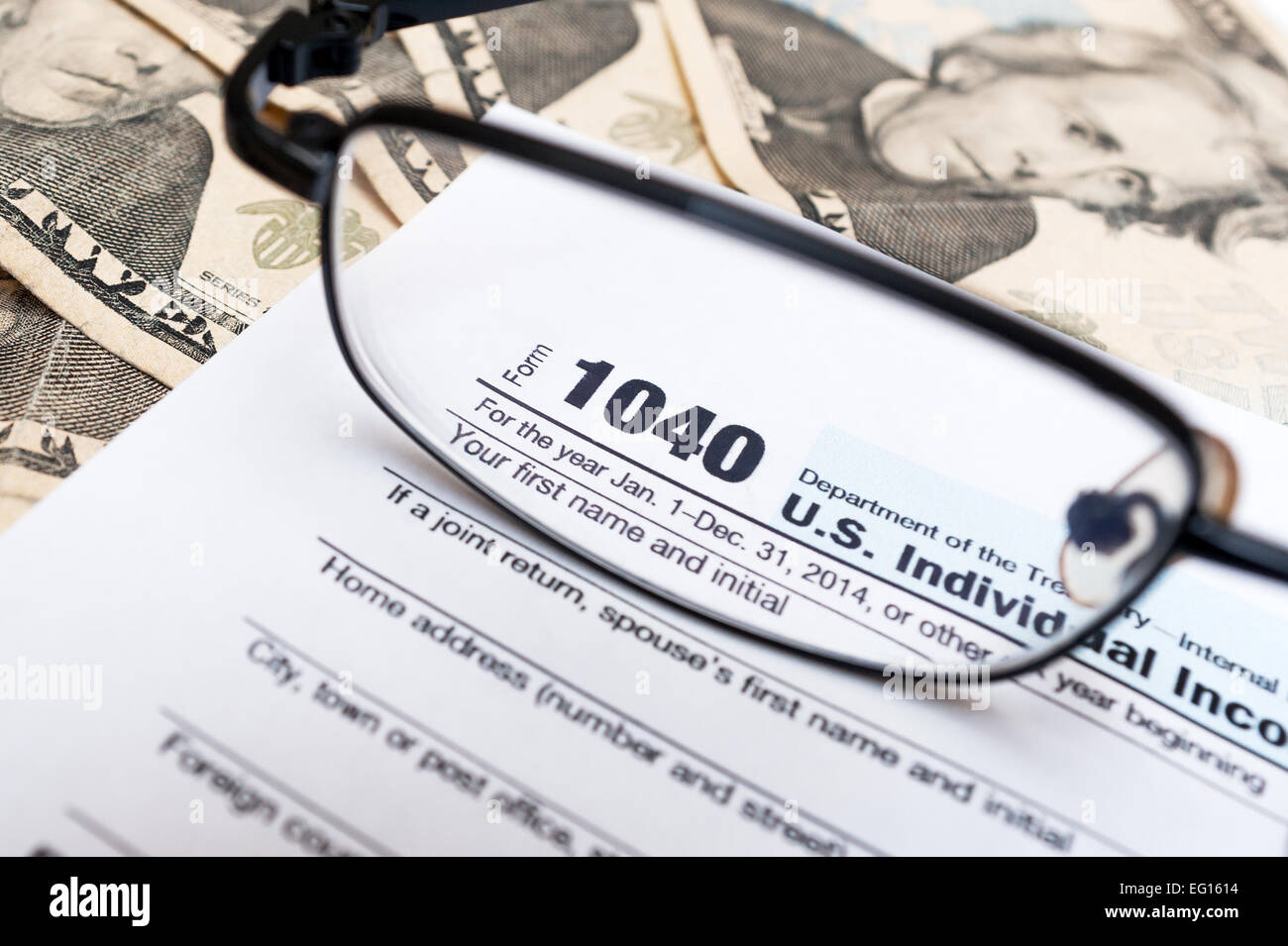 1040 tax form through glasses Stock Photo