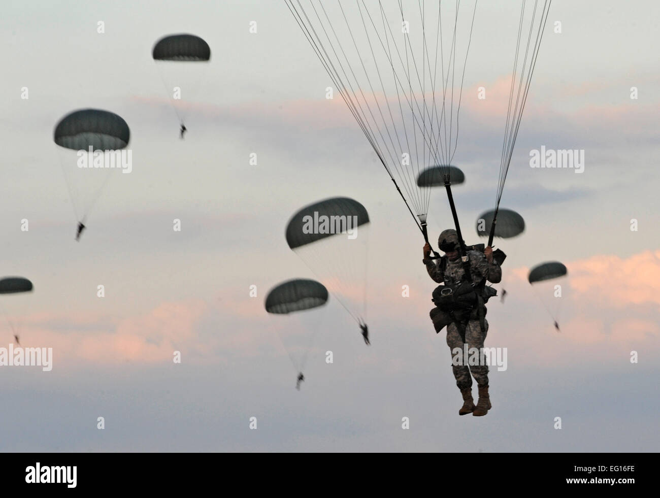 Army Soldiers from the 82nd Airborne Division parachute after jumping from a C-130 Hercules during Airborne Operations at Fort Bragg, N.C. Staff Sgt. Elizabeth Rissmiller Stock Photo