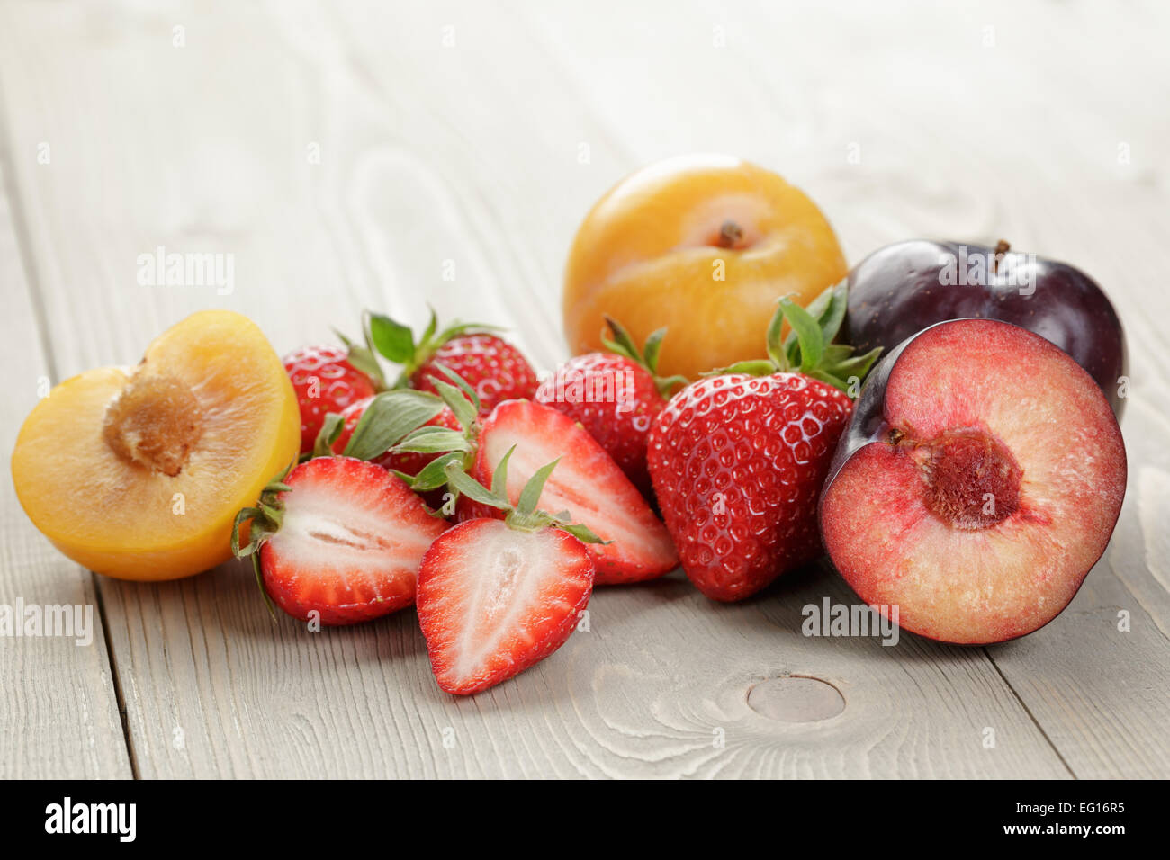 organic fruits on wood table Stock Photo
