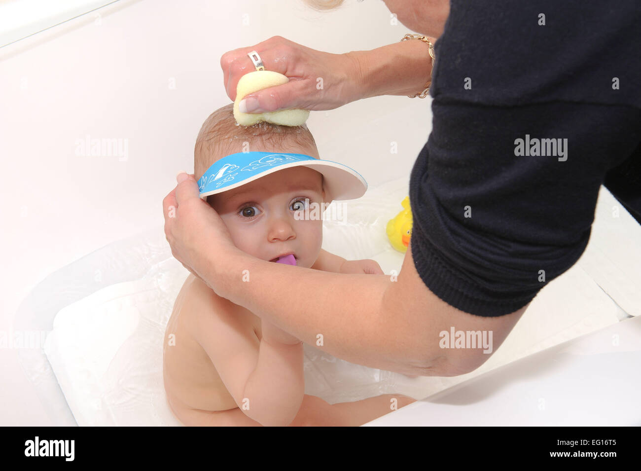 Baby girl at bath time Stock Photo