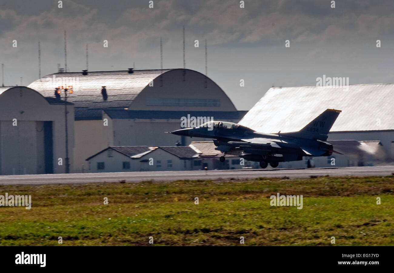 U.S. Air Force Capt. Chris Nations, a 14th Fighter Squadron standardization and evaluations officer, and Staff Sgt. Bernard Mutz, a 35th Civil Engineer Squadron readiness and emergency manager, take off in an F-16 Fighting Falcon aircraft at Misawa Air Base, Japan, Oct. 22, 2010. Sergeant Mutz said he enjoyed seeing the fall colors in the Hokkaido Mountains during his flight, which he earned through outstanding service while assigned to the wing.  Staff Sgt. Samuel Morse Stock Photo