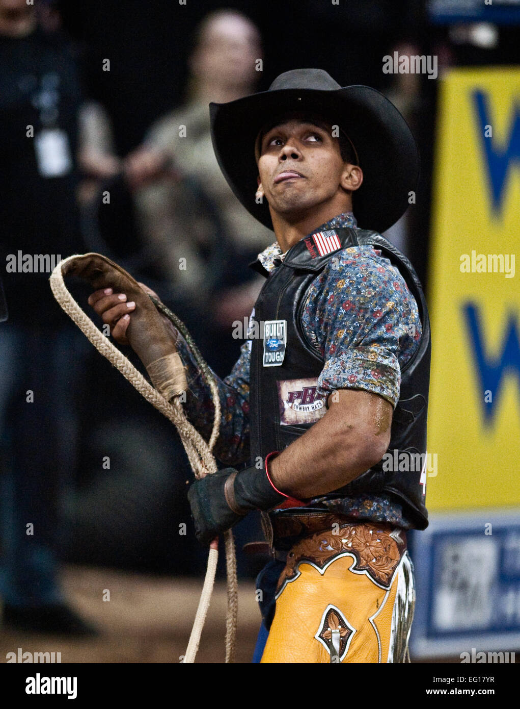 Paulo Lima a professional bull rider looks up at the jumbo tron in the Thomas and Mack Center for his score during the Professional Bull Riding Finals Oct. 22. Nellis Air Force Base Airmen were honored for their service to the country during Air Force night at the PBR Finals .  U.S. Air Force photo / Tech. Sgt. Michael R. Holzworth Stock Photo