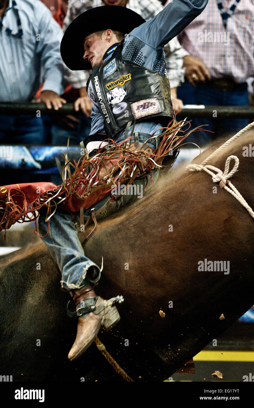 Cody Campbell a professional bull rider does his best to hold on during