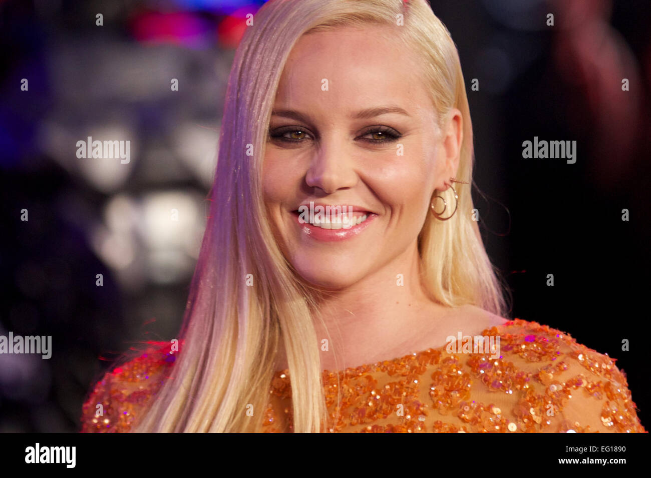 UNITED KINGDOM: Australian actress Abbie Cornish poses for pictures on the red carpet as she arrives for the world premier of 'Robocop' in central London on February 5, 2014. Stock Photo