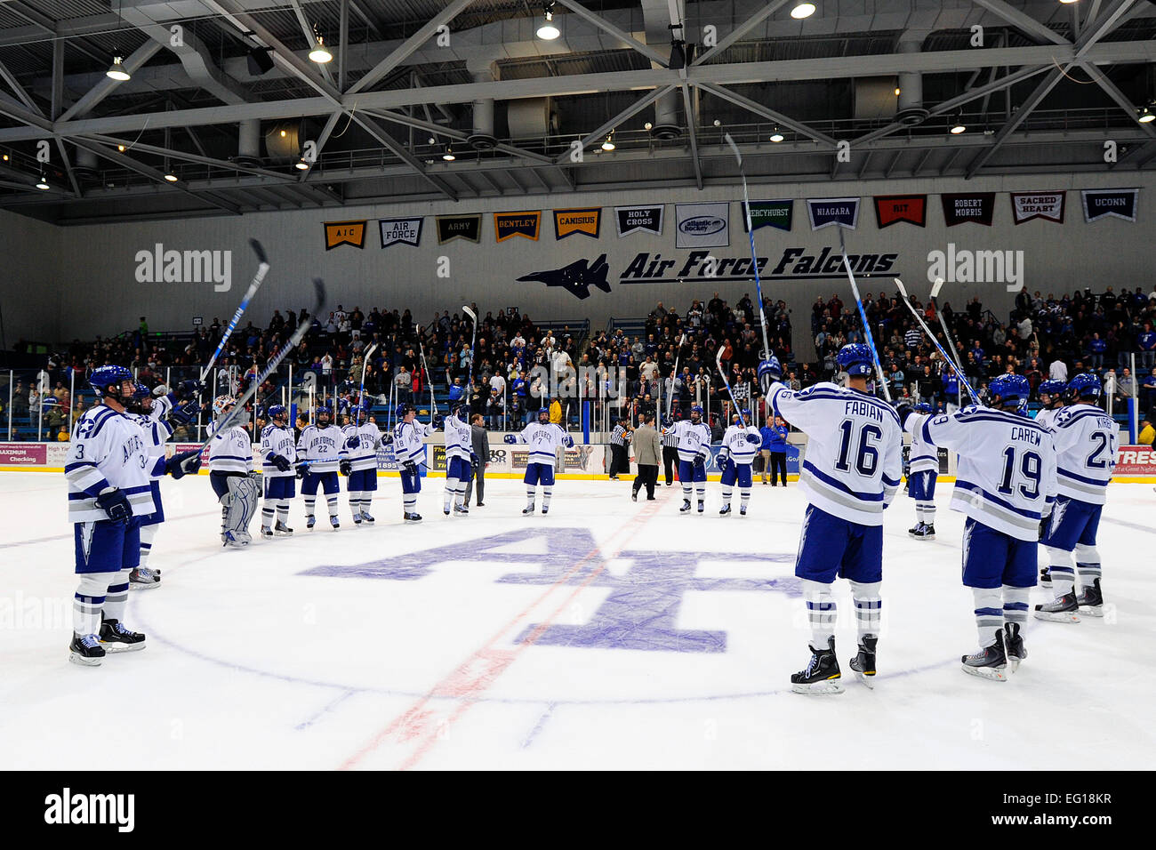 The U.S. Air Force Academy Falcons celebrate at center ice after a