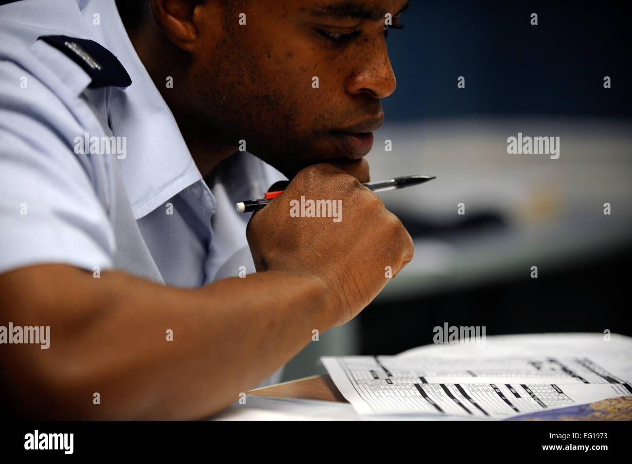 U.S. Air Force Capt. Samuel McKinsey, a B-52H Stratofortress pilot assigned to the 20th Bomb Squadron, reviews mission plans during a mission brief, Nov. 29, 2010, at Barksdale Air Force Base, La. Captain McKinsey is the the aircraft commander for his B-52H and has responsibility of the aircraft's aircrew.  Staff Sgt. Manuel J. Martinez Stock Photo